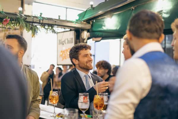 man enjoying after work drinks on the terrace outside