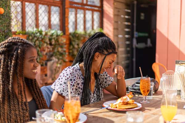 girl laughing at brunch table