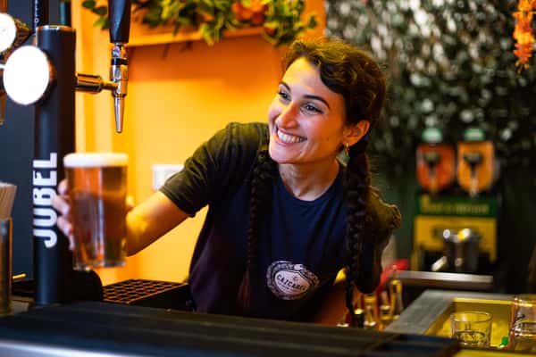 bartender pulling a pint