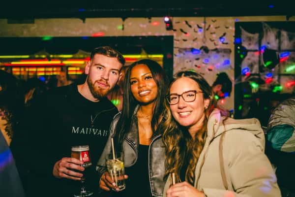 3 friends smiling at camera