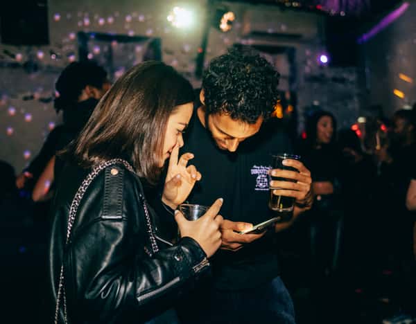 girl and boy looking at phone