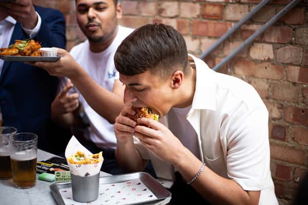 man eating burger