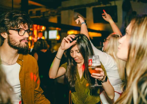 girl dancing with beer