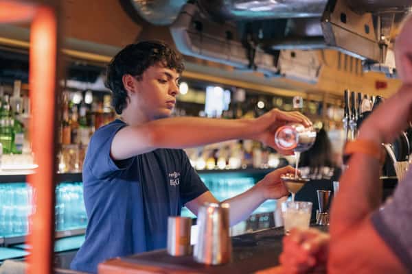 bartender pouring cocktail