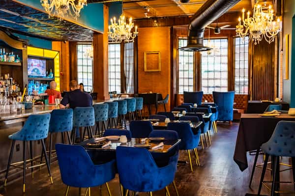 Dining room with blue velvet seating