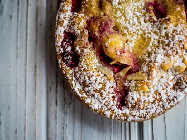Red fruit tart topped with powdered sugar