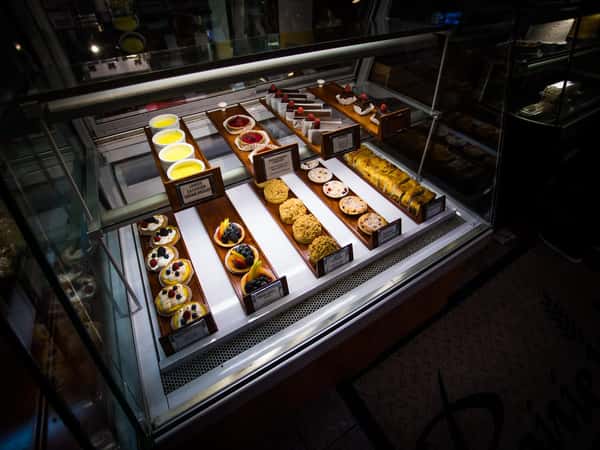 Interior shot of a fridge with several pastries