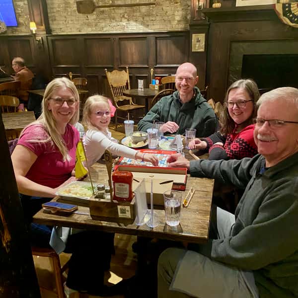 multigenerational family playing Scrabble