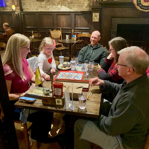 multigenerational family playing scrabble