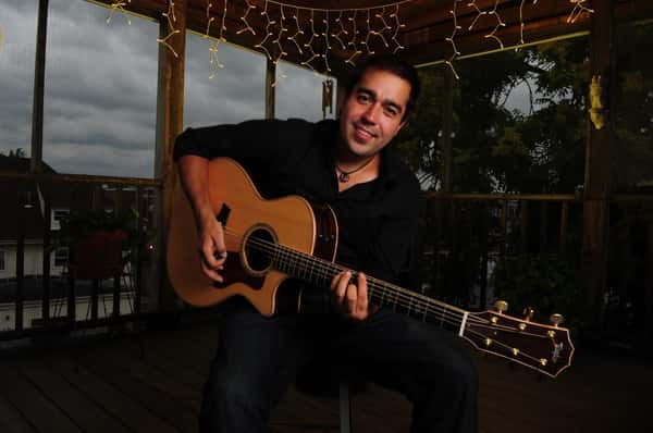 photo of John Sage with guitar