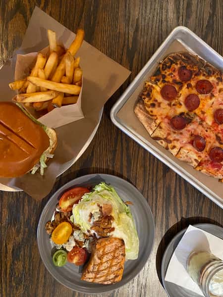 Pizza, burger and salad on a table