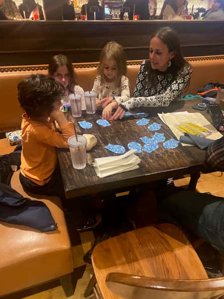 family of 5 playing Go Fish