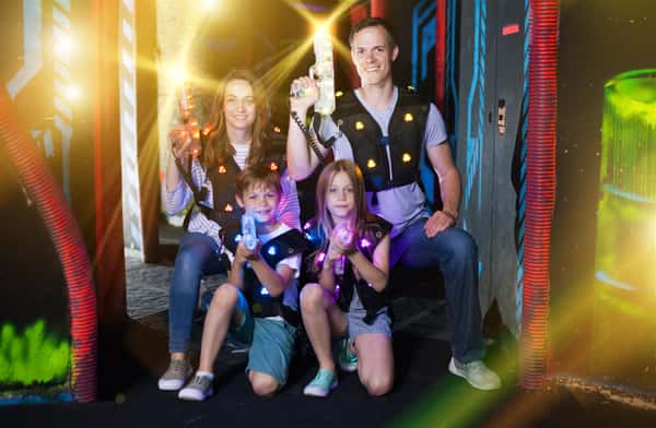 family with laser tag equipment