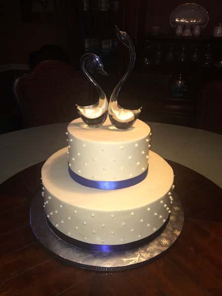 cake with purple ribbons