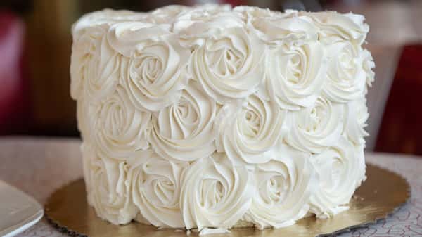 white cake with roses