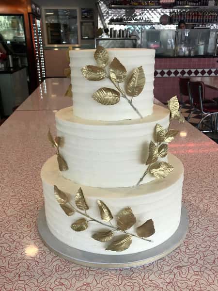 cake with gold vines