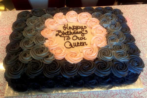 cake with pink and black roses