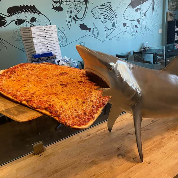 shark eating pizza