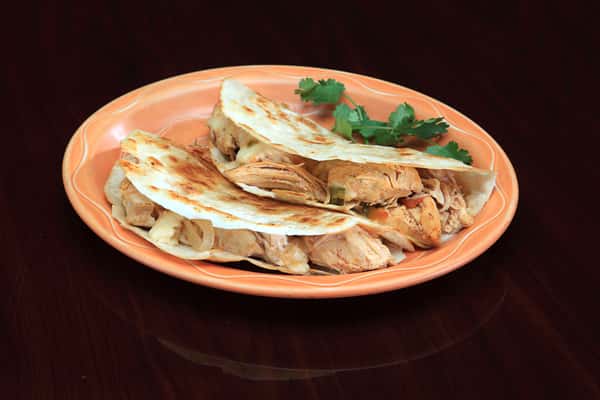 Two Chicken Tacos on orange plate