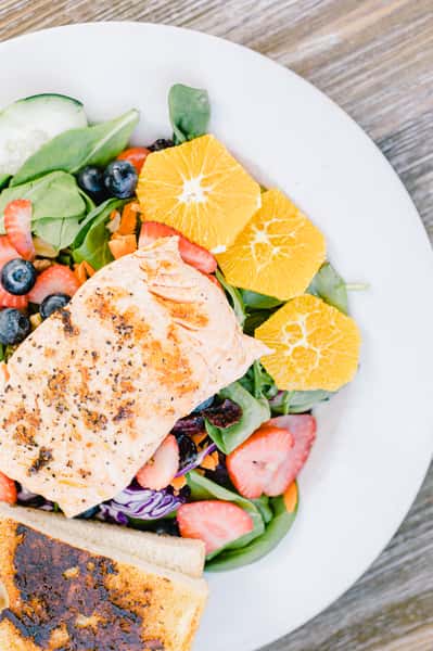 salmon salad with fruit and toast