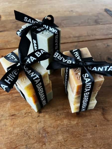 Handcrafted soap bars tied with Santa Barbara Hives branded ribbon
