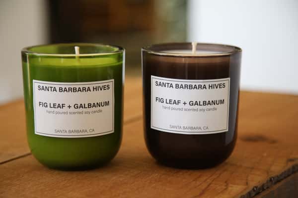Two scented soy candles labeled "Fig Leaf + Galbanum" from Santa Barbara Hives