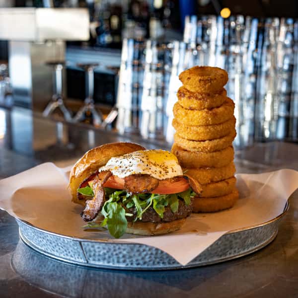burger with egg and onion rings