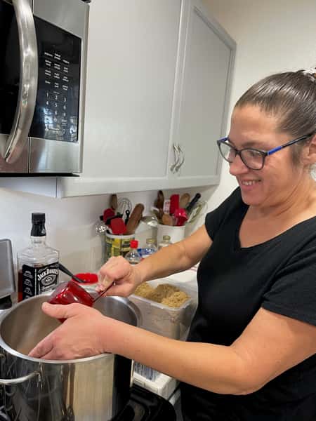 Owner preparing candy apple