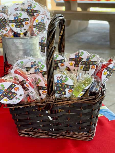 Packaged sweet lollies in a basket