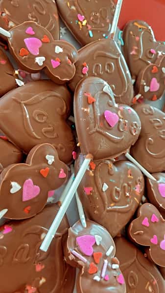 Heart shaped chocolate sweets on a stick
