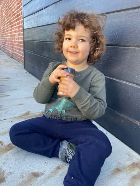 Happy child with goodies in his hand