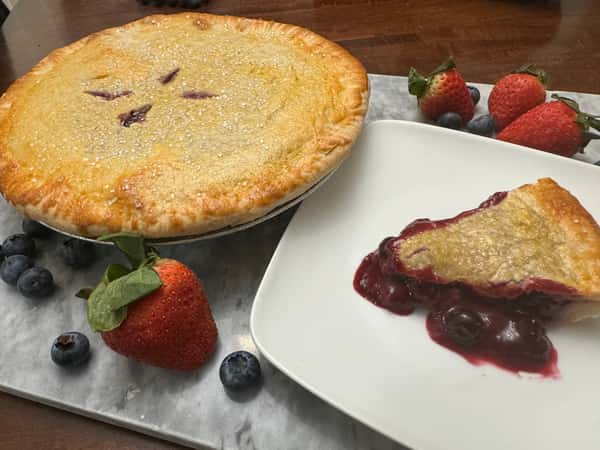 Large pie next to slice of pie