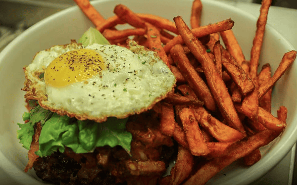 Buger with egg and french fries