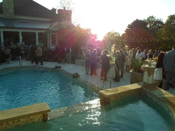 guests standing around a pool