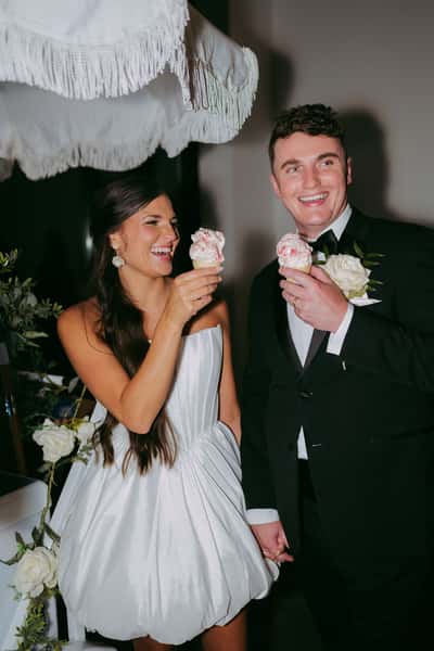Image of newly weds holding an ice cream cone