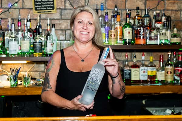 Bartender holding a top shelf Vodka