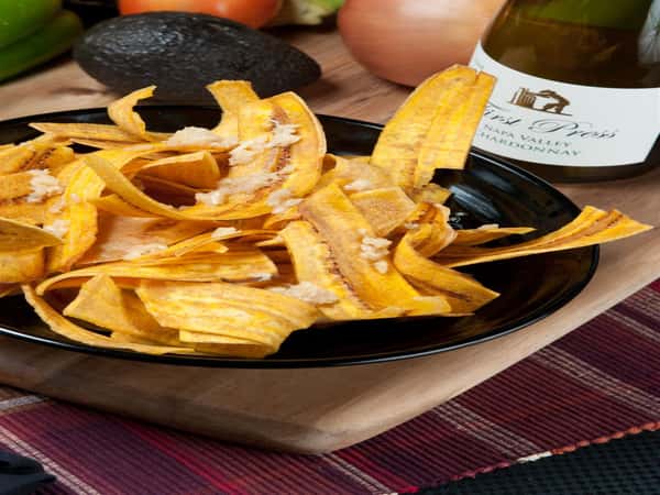 Mariquitas Plantain Chips topped with garlic sauce
