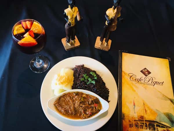 Ropa Vieja Shredded beef slow-cooked in tomato and wine sauce