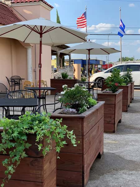 outside dining area with plants