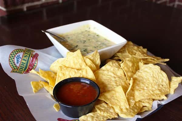 Spinach and Artichoke dip with tortilla chips and salsa