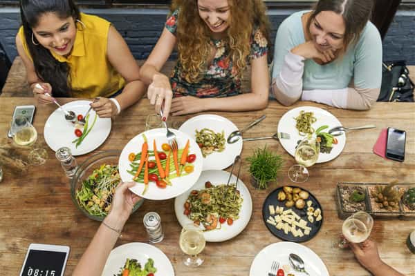 females eating a meal at a table