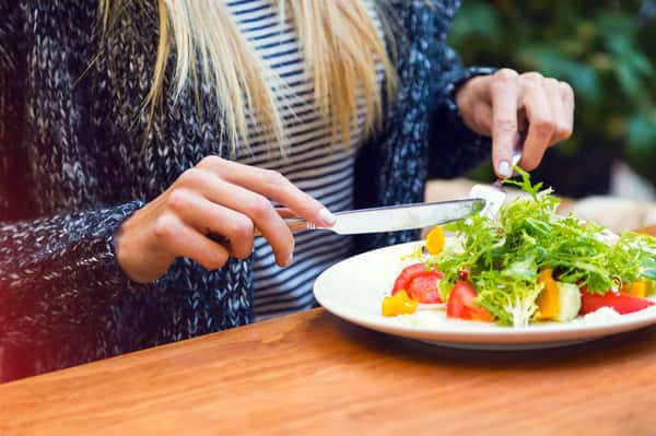 female enjoying a salad