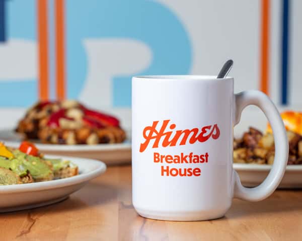 "Himes Breakfast House classic breakfast spread with mug