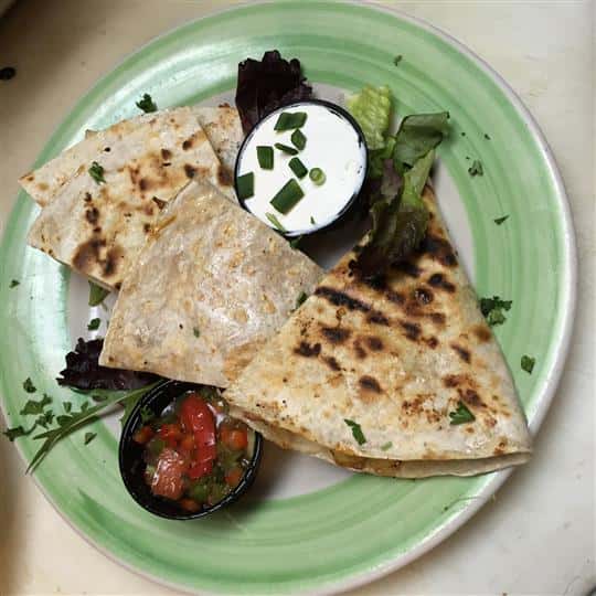 quesadilla with side of sour cream