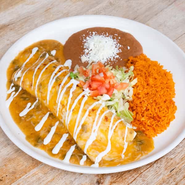 Smothered Mexican burrito topped with melted cheese and creamy sauce, served with Spanish rice and refried beans