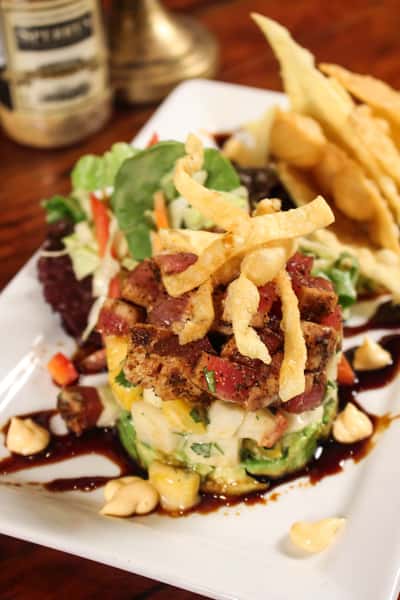 Fresh salad topped with grilled chicken, crispy onion straws, and house-made dressing.