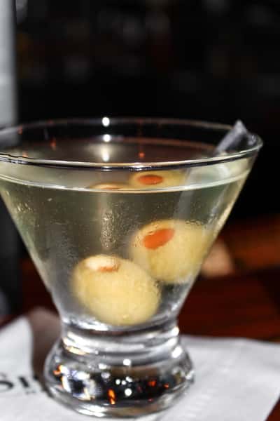 Classic dirty martini garnished with olives at Sperry's Restaurant.