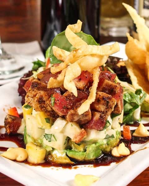 Grilled chicken entrée topped with crispy onion straws and served with fresh vegetables.
