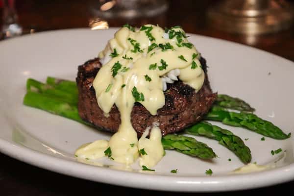 Filet mignon topped with creamy béarnaise sauce and served with fresh asparagus.