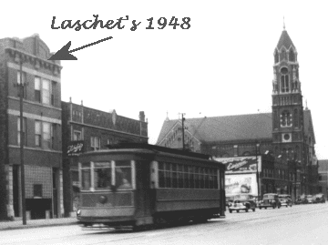 Vintage streetcar passing by Laschet's tavern in 1948 with a church in the background.